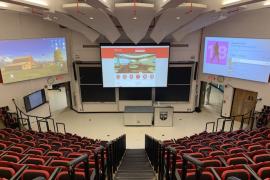 Physical Lecture Hall boasts three projection screens and one display monitor.